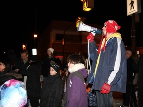 Meet Me At the Bell Tower, a weekly rally on Selkirk Avenue that recently celebrated its four-year anniversary, will be presented with an award next week. Michael Champagne is shown at centre. (COURTESY OF HOWARD WONG)