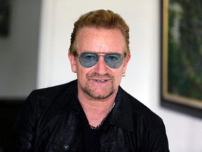 In this Friday, Aug. 28, 2015, file photo, Irish rock star Bono speaks during an interview with The Associated Press in Lagos, Nigeria. (AP Photo/Sunday Alamba, File)