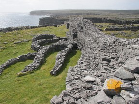 In Ireland's Aran Islands, a stone fortress hangs precariously on a cliff above the Atlantic. (Photo: Pat O’Connor)