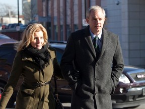Dennis Oland arrives at the Saint John Law Courts building with his wife Lisa following a lunch break after spending the morning on the stand at his trial in Saint John, N.B., Tuesday, Dec.1, 2015. THE CANADIAN PRESS/Ron Ward