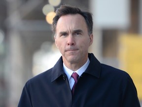 Finance Minister Bill Morneau walks to an event to give an update to Canadians on the Liberal government's economic and fiscal status, in Ottawa, on Friday, Nov. 20, 2015. THE CANADIAN PRESS/Adrian Wyld