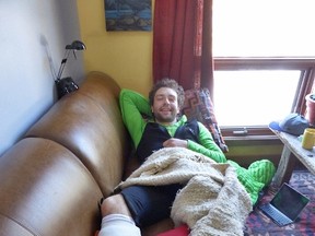 Greg Boswell, a British mountain climber, rests after being attacked by a grizzly bear on Mt. Wilson in Banff National Park