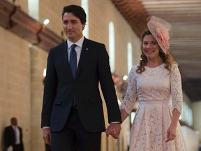 Prime Minister Justin Trudeau walks with his wife Sophie Gregoire-Trudeau as they arrive at the Commonwealths Heads of Government meeting, in Valletta, Malta., on Nov. 27, 2015. (THE CANADIAN PRESS/Adrian Wyld)