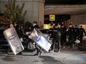 Riot police arrive after an explosion on a highway overpass near a subway station wounded five people and was caused by a bomb, according to information given by the local mayor, in Istanbul, Turkey, on Dec. 1, 2015. (AP Photo/Cagdas Erdogan)