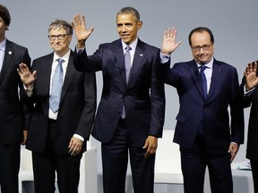 (LtoR) Canadian Prime Minister Justin Trudeau, Microsoft CEO Bill Gates, US President Barack Obama, French President Francois Hollande and Indian Prime Minister Narendra Modi pose for a family photo during the "Mission Innovation - Accelerating the Clean Energy Revolution" meeting on the opening day of the World Climate Change Conference 2015 (COP21) at Le Bourget, near Paris, on November 30, 2015. More than 150 world leaders are meeting under heightened security, for the 21st Session of the Conference of the Parties to the United Nations Framework Convention on Climate Change (COP21/CMP11), also known as Paris 2015 from November 30 to December 11. AFP PHOTO / POOL / IAN LANGSDON