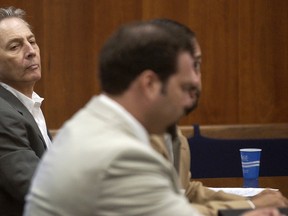 In this Aug. 18, 2003 file photo, Robert Durst, left, sits in a courtroom during a pre-trial hearing at the Galveston County Courthouse in Galveston, Texas. Relatives of the millionaire's missing wife, Kathleen Durst, have filed a $100 million lawsuit against him in her presumed death. (AP Photo/Galveston County Daily News, Kevin Bartram, File)