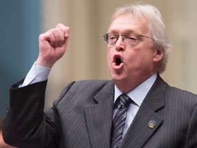 Quebec Health Minister Gaetan Barrette responds to the Opposition, during question period,Tuesday, December 1, 2015 at the legislature in Quebec City. The Quebec government will seek leave to appeal a court ruling that would postpone the implementation of a provincial law on assisted dying. Barrette reiterated his belief that the law is valid. THE CANADIAN PRESS/Jacques Boissinot