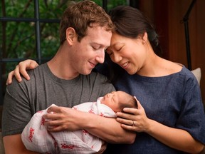 Facebook Inc. Chief Executive Mark Zuckerberg and his wife Priscilla are seen with their daughter named Max in this image released on December 1, 2015. Zuckerberg and his wife said they plan to give away 99 percent of their fortune in Facebook stock to a new charity the couple were creating, while announcing the birth of their first child on Tuesday. REUTERS/Courtesy of Mark Zuckerberg/Handout