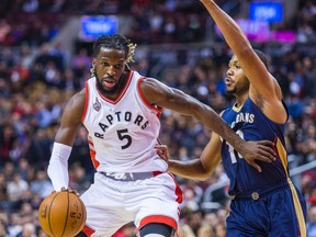 Raptors' DeMarre Carroll controls the ball while Pelicans' Eric Gordon defends during first half NBA action in Toronto on Nov. 13, 2015. (Ernest Doroszuk/Toronto Sun)