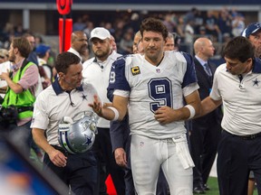 Cowboys quarterback Tony Romo (9) leaves the game after breaking his collarbone for the second time this season on Nov. 26, 2015. (Jerome Miron/USA TODAY Sports)