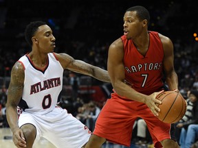 Toronto Raptors guard Kyle Lowry (7) dribbles the ball as Atlanta Hawks guard Jeff Teague (0) defends during the first half at Philips Arena on Nov. 26, 2014. (DALE ZANINE/USA TODAY Sports files)