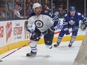 Dustin Byfuglien of the Winnipeg Jets skates with the puck against the Toronto Maple Leafs during an NHL game at the Air Canada Centre on Nov. 4, 2015 in Toronto. (CLAUS ANDERSEN/Getty Images/AFP files)