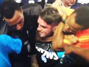 A Cowboys security guard appears to choke a Carolina Panthers fan.