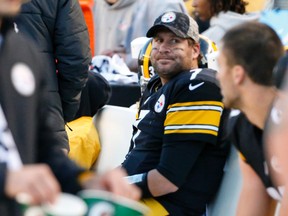 In this Nov. 8, 2015, file photo, Pittsburgh Steelers quarterback Ben Roethlisberger (7) sits on  the bench after being injured in an NFL football game against the Oakland Raiders.  (AP Photo/Gene J. Puskar, File)