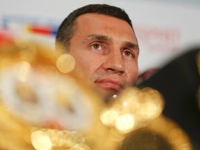 Ukrainian heavyweight boxing world champion Vladimir Klitschko listens during a news conference in Duesseldorf, Germany, July 21, 2015. Unbeaten British boxer Tyson Fury will get a shot at the world heavyweight title in October after agreeing terms for a meeting with champion Klitschko. The 39-year-old Ukrainian's WBA, WBO, IBF and IBO crowns will be on the line when the pair meet in the German city of Duesseldorf October 24, 2015 in Duesseldorf. REUTERS/Ina Fassbender