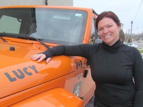 Natasha Kokkinis is shown with her Jeep named Lucy, on Wednesday December 2, 2015 in Sarnia, Ont. Kokkinis and other members of the Lambton County Jeepers club are holding a Jam A Jeep event Saturday, 10 a.m. to 4 p.m., at the Coffee Lodge on Exmouth Street. They're asking donors to bring new, unwrapped toys for the Salvation Army. Paul Morden/Sarnia Observer/Postmedia Network