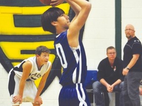 Hawk Justin Wang attempts a free throw Monday, Nov. 30 during the first game of the season for the County Central High School senior boys' basketball team in Nobleford. Noble Central School defeated the Hawks 55-43. Stephen Tipper Vulcan Advocate