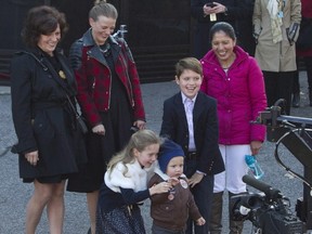 Prime minister-designate Justin Trudeau's children Xavier, Ella-Grace and Hadrien (right to left) wave to a television camera as they wait for their parents to arrive at Rideau Hall in Ottawa, November 4, 2015. Margaret Trudeau (top left) and nanny Marilou Trayvilla (top right) look on. The Liberals are attempting to shake off questions about two taxpayer-funded nannies who provide care for Justin Trudeau's three young children.THE CANADIAN PRESS/Fred Chartrand