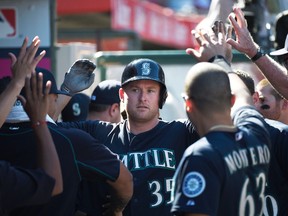 Seattle Mariners right fielder Mark Trumbo (35) celebrates with the dugout after hitting a solo home run against the Los Angeles Angels during the eighth inning at Angel Stadium of Anaheim. Kelvin Kuo-USA TODAY Sports