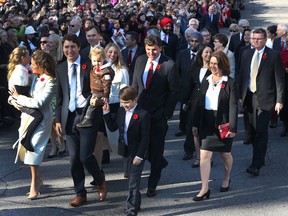 Justin Trudeau and his wife Sophie Gregoire-Trudeau and their kids lead the new Liberal cabinet to Rideau Hall in Ottawa on Wednesday, Nov. 4, 2015. Trudeau is being criticized by opposition parties for using taxpayer money to pay for two nannies who help to care for his children.  Tony Caldwell/Ottawa Sun/Postmedia Network