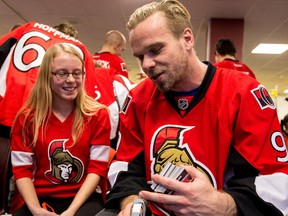 Ottawa Senators' Milan Michalek explains his finger injury to fifteen year old CHEO patient Madison Kovacs during the annual pre-Christmas visit to the hospital by the team. Wednesday December 2, 2015. Errol McGihon/Ottawa Sun/Postmedia Network