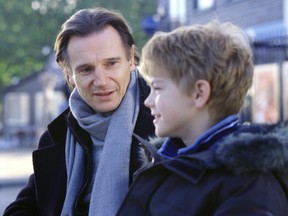 Liam Neeson, left, and Thomas Sangster in the romantic comedy movie Love, Actually. (Peter Mountain)