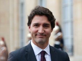 Canadian Prime Minister Justin Trudeau answers media after a meeting, at the Elysee Palace, in Paris, Sunday, Nov. 29, 2015. More than 140 world leaders are gathering around Paris for high-stakes climate talks that start Monday, and activists are holding marches and protests around the world to urge them to reach a strong agreement to slow global warming. (AP Photo/Thibault Camus)