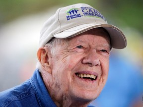 In a Monday, Nov. 2, 2015 file photo, former President Jimmy Carter answers questions during a news conference at a Habitat for Humanity building site, in Memphis, Tenn. Jimmy Carter's grandson Jason Carter said Wednesday, Dec. 2, 2015, the 91-year-old former president is doing well while undergoing cancer treatment and showing no sign of slowing down, despite his pledge to do just that. (AP Photo/Mark Humphrey, File)