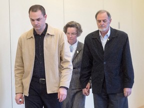 Guy Turcotte is followed into the courtroom by his parents to hear a question from the jury as they deliberate for the third day, Wednesday, December 2, 2015 in Saint- Jerome, Que. Turcotte is being retried for the murder of his two children. THE CANADIAN PRESS/Ryan Remiorz