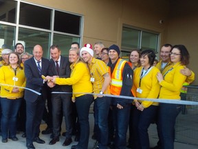 London Mayor Matt Brown and Stefan Sjostrand, president of IKEA Canada, along with staff at London?s new Pick-Up point celebrate the opening of the mini-IKEA on Wonderland Road. (JANE SIMS, The London Free Press)