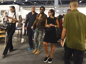 Designer Barbara Becker, curator Reiner Opoku and musician Lenny Kravitz attend the Art Basel Miami Beach - VIP Preview at the Miami Beach Convention Center on December 2, 2015 in Miami Beach, Florida.  Gustavo Caballero/Getty Images/AFP