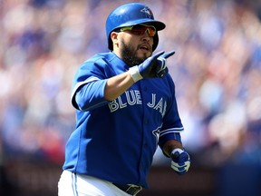 Dioner Navarro #30 of the Toronto Blue Jays celebrates after hitting a home run in the second inning during a MLB game against the Boston Red Sox at Rogers Centre on September 20, 2015 in Toronto, Ontario, Canada.   Vaughn Ridley/Getty Images/AFP