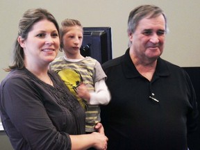 Brianne Jourdin and her daughter Kenadie Jourdin-Bromley, 12, pose for photos with Phil Eagen, of the Sarnia Accessibility Advisory Committee, on Thursday December 3, 2015 in Sarnia, Ont. The Kitchener mother and daughter were guest speakers at Sarnia's annual International Day of People with Disability celebration held at the Lambton Event Centre. Other guest speakers included musician Jeff Poolton and disability advocate Jeff Preston. (Barbara Simpson, The Observer)