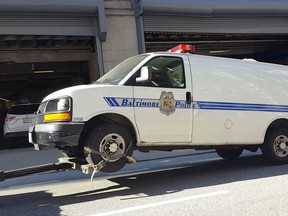 The Baltimore police van Freddie Gray was transported in the day of his arrest and injury is moved to the Courthouse East garage prior to being shown to jurors in the trial of officer William Porter on Thursday, Dec. 3, 2015 in Baltimore. Jurors did not ask any questions about the van when they inspected it, and were not given any information about it during the viewing, Baltimore Circuit Judge Barry Williams said. Reporters and members of the public were not allowed to witness the jurors' viewing. (Ian Duncan/The Baltimore Sun via AP)