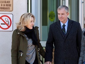 Dennis Oland and his wife Lisa leave the Law Courts building for a lunch break after spending the morning on the stand at his trial in Saint John, N.B., Tuesday, Dec.1, 2015. THE CANADIAN PRESS/Ron Ward