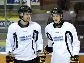 Sarnia Sting forwards Pavel Zacha, left, and Jordan Kyrou discuss a drill during practice at the Sarnia Sports and Entertainment Centre on Thursday Dec. 3, 2015 in Sarnia, Ont. Zacha and Kyrou have formed a new line with Troy Lajeunesse as the Sting prepare to host the North Bay Battalion Friday at 7:05 p.m. (Terry Bridge, The Observer)