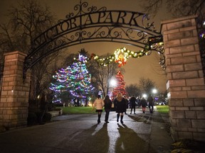 People walk into Victoria Park moments after the lighting of the lights in London, Ont. On Friday November 27, 2015.  Craig Glover/Postmedia Network