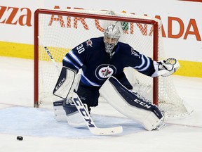 Dec 2, 2015; Winnipeg, Manitoba, CAN;  Winnipeg Jets goalie Connor Hellebuyck (30) looks to make a save during the second period against the Toronto Maple Leafs at MTS Centre. Mandatory Credit: Bruce Fedyck-USA TODAY Sports