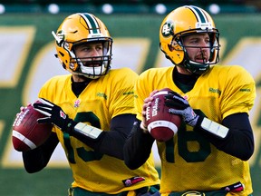 Mike Reilly left, and Matt Nichols, shown here in November 2014, began this season as teammates, with Nichols stepping into the starter's role after Reilly was injured in the first game of the season. (Codie McLachlan, Edmonton Sun)