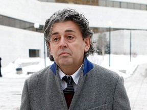 Joseph LeClair, former priest of Blessed Sacrament church in the Glebe, is photographed leaving the Ottawa Courthouse on Monday January 20, 2014. LeClair pleaded guilty after he exploited lax bookkeeping to pilfer $130,000 church funds and fund his gambling debts, according to an agreed statement of facts read out in court Darren Brown/Ottawa Sun/QMI Agency