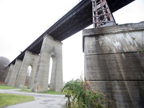 A woman and her adult daughter died after they jumped earlier this week from this decommissioned railway bridge in St. Thomas, which towers 27 metres above a busy road. (DEREK RUTTAN, The London Free Press)