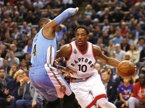 Raptors' DeMar DeRozan drives against the Nuggets' Randy Foye during NBA action in Toronto on Thursday, Dec. 3, 2015. (Michael Peake/Toronto Sun)