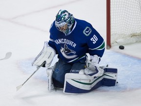 Canucks goalie Ryan Miller allows a goal to Stars forward Patrick Sharp during third period NHL action in Vancouver on Thursday, Dec. 3, 2015. (Darryl Dyck/THE CANADIAN PRESS)