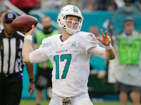 Miami Dolphins quarterback Ryan Tannehill looks to pass during the first half of an NFL football game in Miami Gardens, Fla., on Nov. 22, 2015.  (AP Photo/Wilfredo Lee)