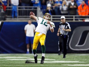 Green Bay Packers quarterback Aaron Rodgers throws a hail mary during the fourth quarter against the Detroit Lions at Ford Field. Packers win 27-23. (Raj Mehta/USA TODAY Sports)