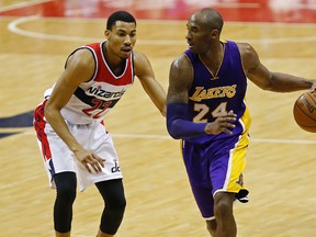 Los Angeles Lakers forward Kobe Bryant dribbles the ball as Washington Wizards forward Otto Porter Jr. defends in the third quarter at Verizon Center. (Geoff Burke/USA TODAY Sports)