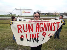 Rachel Thevenard, a 22-year-old student from Kitchener, set out on a run Friday December 4, 2015 in Sarnia, Ont., to raise environmental concerns about Enbridge's Line 9 reversal project. She is planning to run from Sarnia to Montreal. (Paul Morden/Sarnia Observer/Postmedia Network)