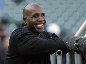 Steroids-tainted home run king Barry Bonds is returning to baseball full time as hitting coach for the Miami Marlins. (AP Photo/Jeff Chiu, File)