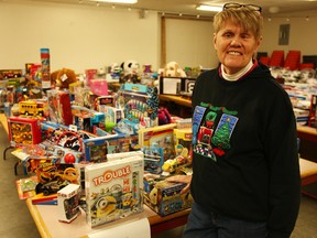 Wendy Hutton stands behind all the gifts at the Agriplex in Seaforth.(Shaun Gregory/Huron Expositor)