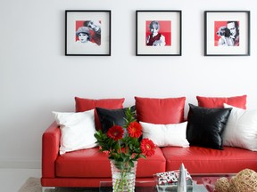 A top quality leather sofa in red adds a  dramatic and colourful touch to this living space.